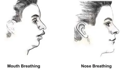 Person wearing nasal strips at night to aid nasal breathing transition.